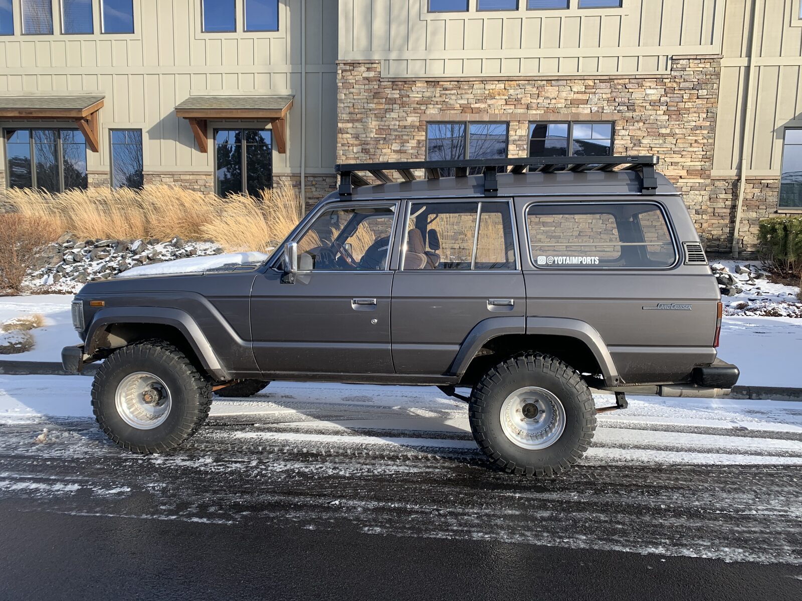 60 Series Land Cruiser lifted with light bar at sunset