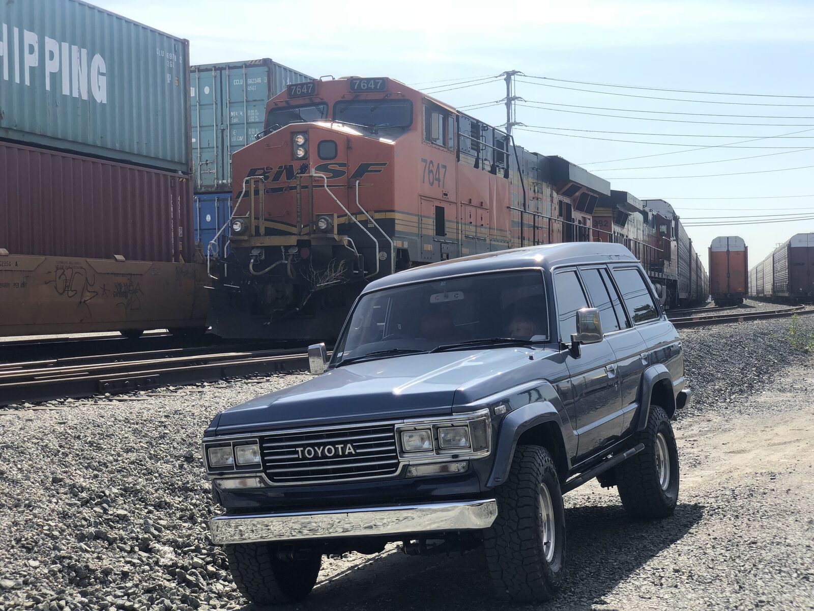 60 Series Land Cruiser next to a BNSF freight train