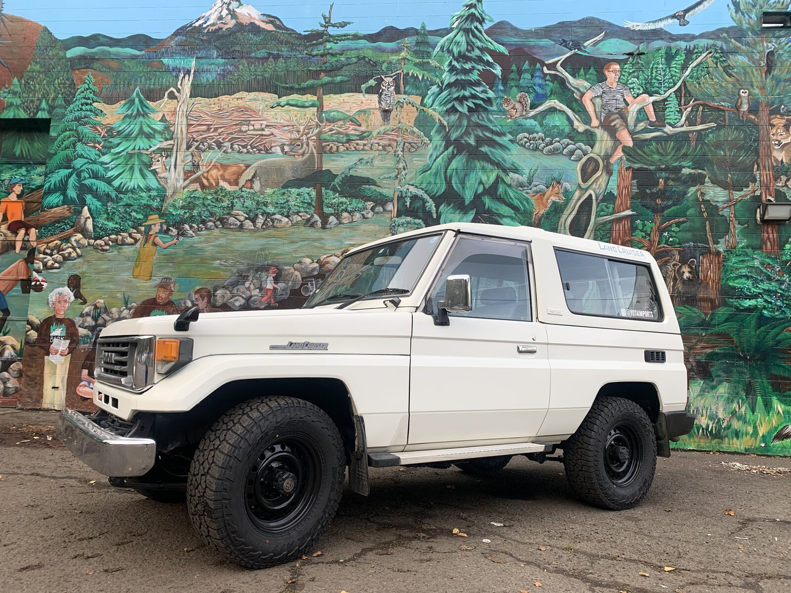 70 Series Land Cruiser Troopy in front of a mural