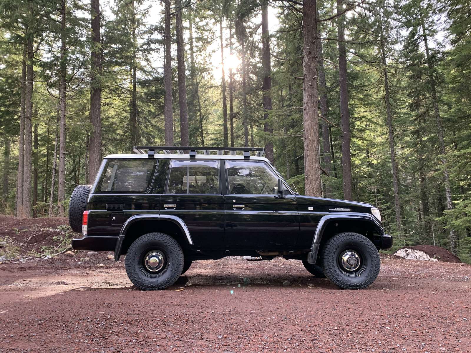Blue Prado Land Cruiser in the snow with roof rack